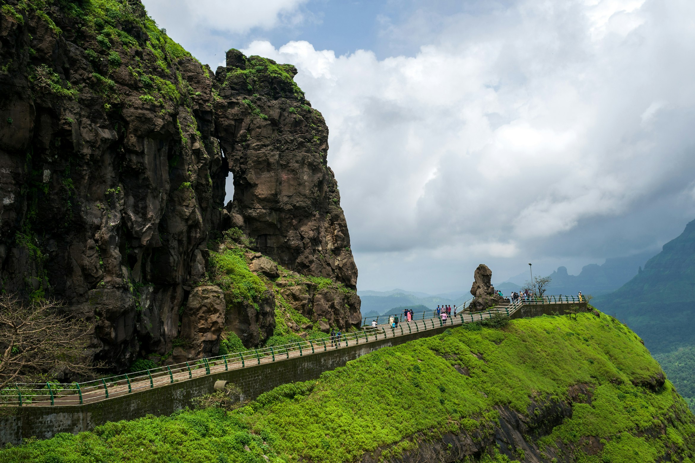 The dramatic monsoon landscape of Malshej Ghat with cascading waterfalls and misty mountains
